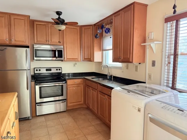 a kitchen with a stove and a microwave