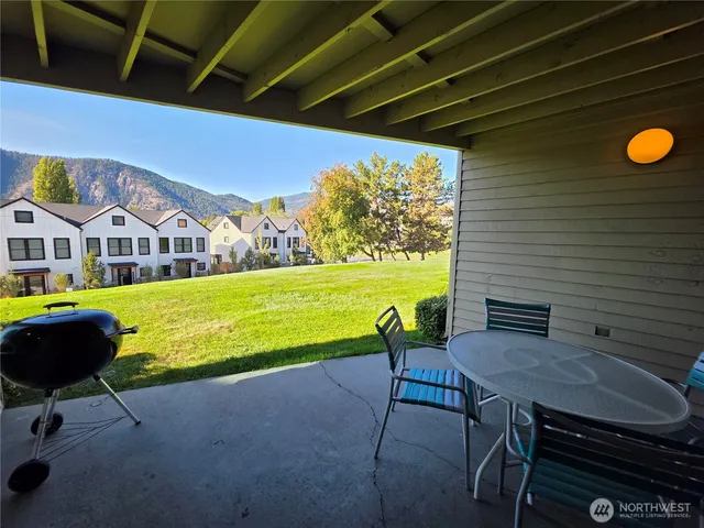 a view of a swimming pool with an outdoor seating