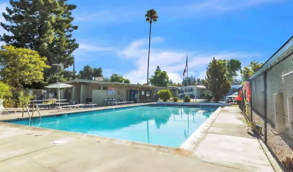a view of a swimming pool with a lounge chairs