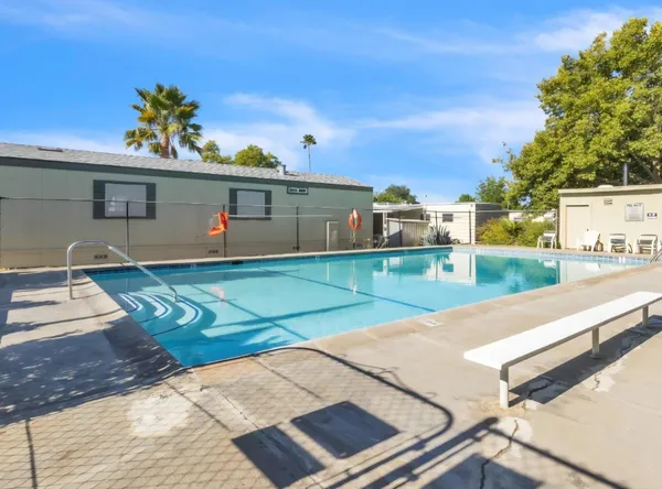 a view of a backyard with a patio