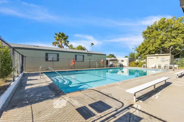 a front view of a house with a yard and a garage