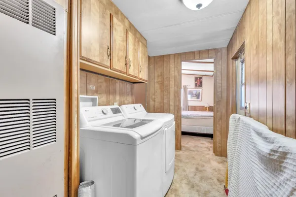 a en suite bathroom with a sink a mirror and a bathtub