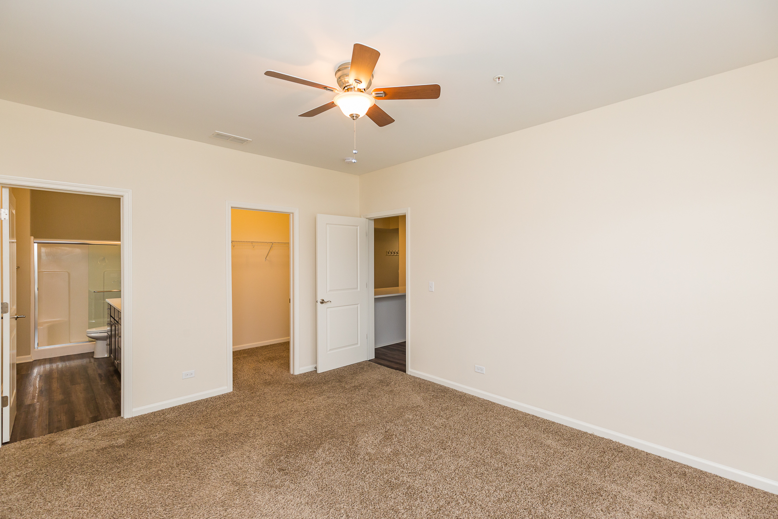 60 West Main Street, Unit 233 Lake Zurich, IL 60047 - Photo 10 of 15 a view of a livingroom with a ceiling fan