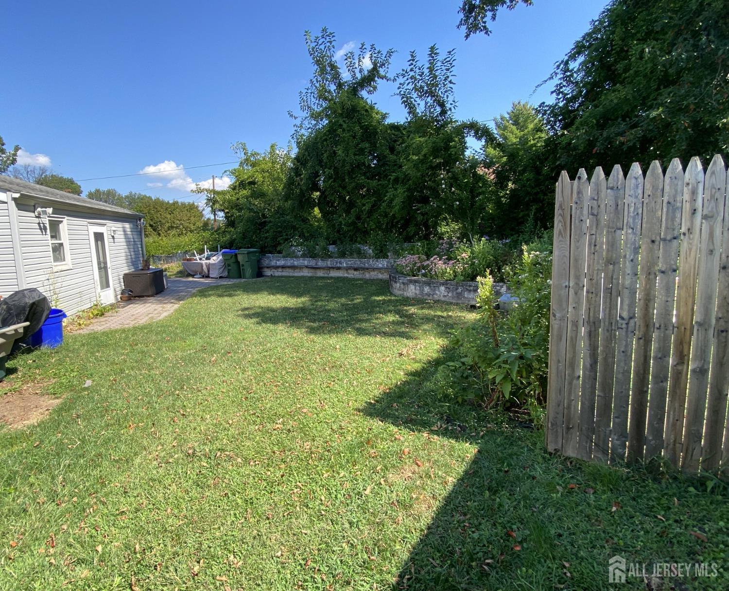 2 Avon Road Edison, NJ 08817 - Photo 3 of 11 a view of a backyard with a garden and plants