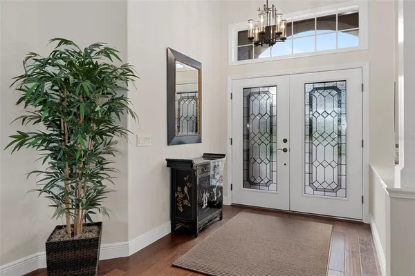 a kitchen with stainless steel appliances granite countertop a sink a stove and a wooden cabinets