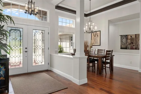 a kitchen with granite countertop a sink dishwasher stove and cabinets