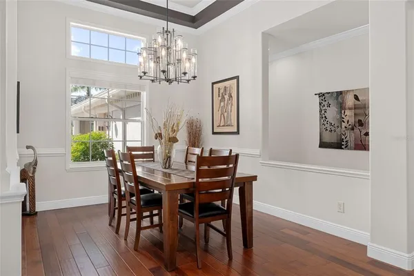 a kitchen with stainless steel appliances kitchen island granite countertop a refrigerator and a stove top oven