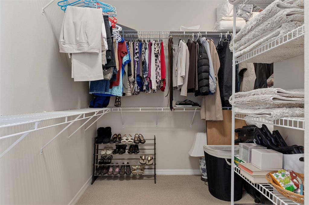 1601 North Tee Time Terrace Hernando, FL 34442 - Photo 50 of 68 a view of walk in closet with clothes and shoes