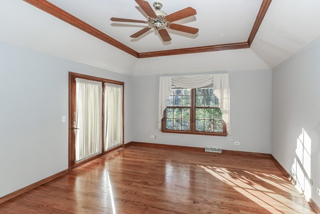 102 Wilcox Drive Bartlett, IL 60103 - Photo 14 of 30 a view of an empty room with a window and wooden floor