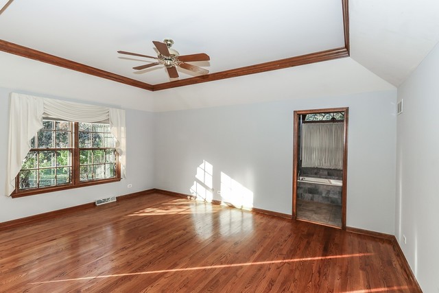 102 Wilcox Drive Bartlett, IL 60103 - Photo 15 of 30 a view of empty room with wooden floor and fan