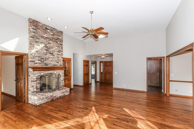 102 Wilcox Drive Bartlett, IL 60103 - Photo 3 of 30 a view of an empty room with window and wooden floor