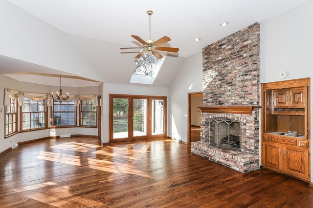 102 Wilcox Drive Bartlett, IL 60103 - Photo 4 of 30 a living room with fireplace furniture and a wooden floor
