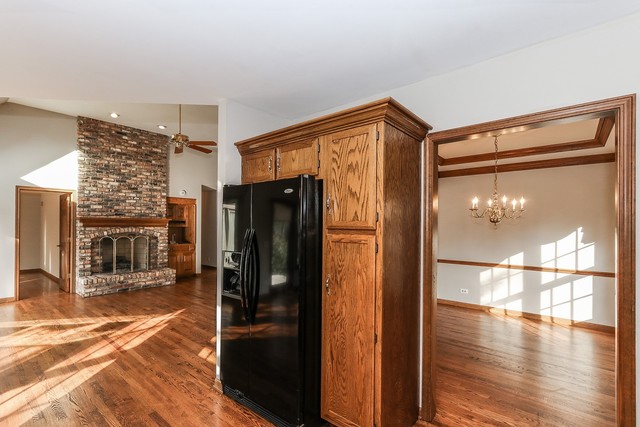 102 Wilcox Drive Bartlett, IL 60103 - Photo 10 of 30 a view of a refrigerator in kitchen and a living room