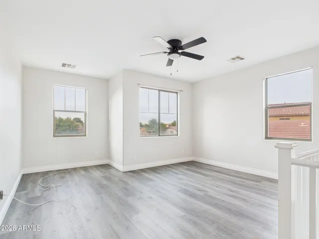 a spacious bathroom with a double vanity sink a mirror and a shower