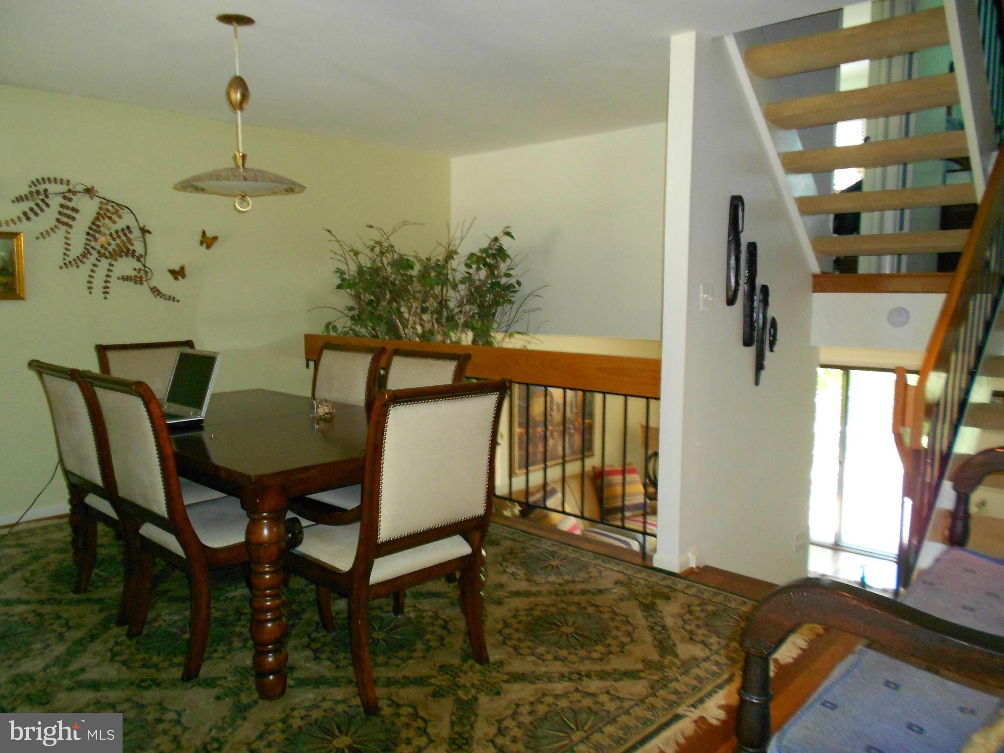 2079 Wethersfield Court Reston, VA 20191 - Photo 13 of 30 Main level dining open to living room below.