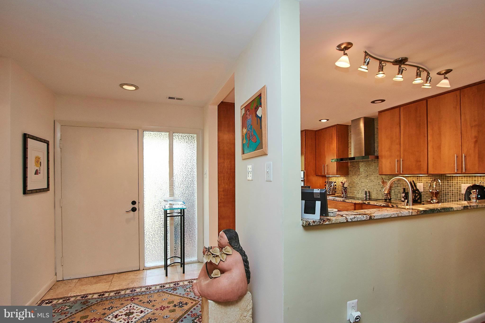 2079 Wethersfield Court Reston, VA 20191 - Photo 6 of 30 View of entry and kitchen which is open to dining.