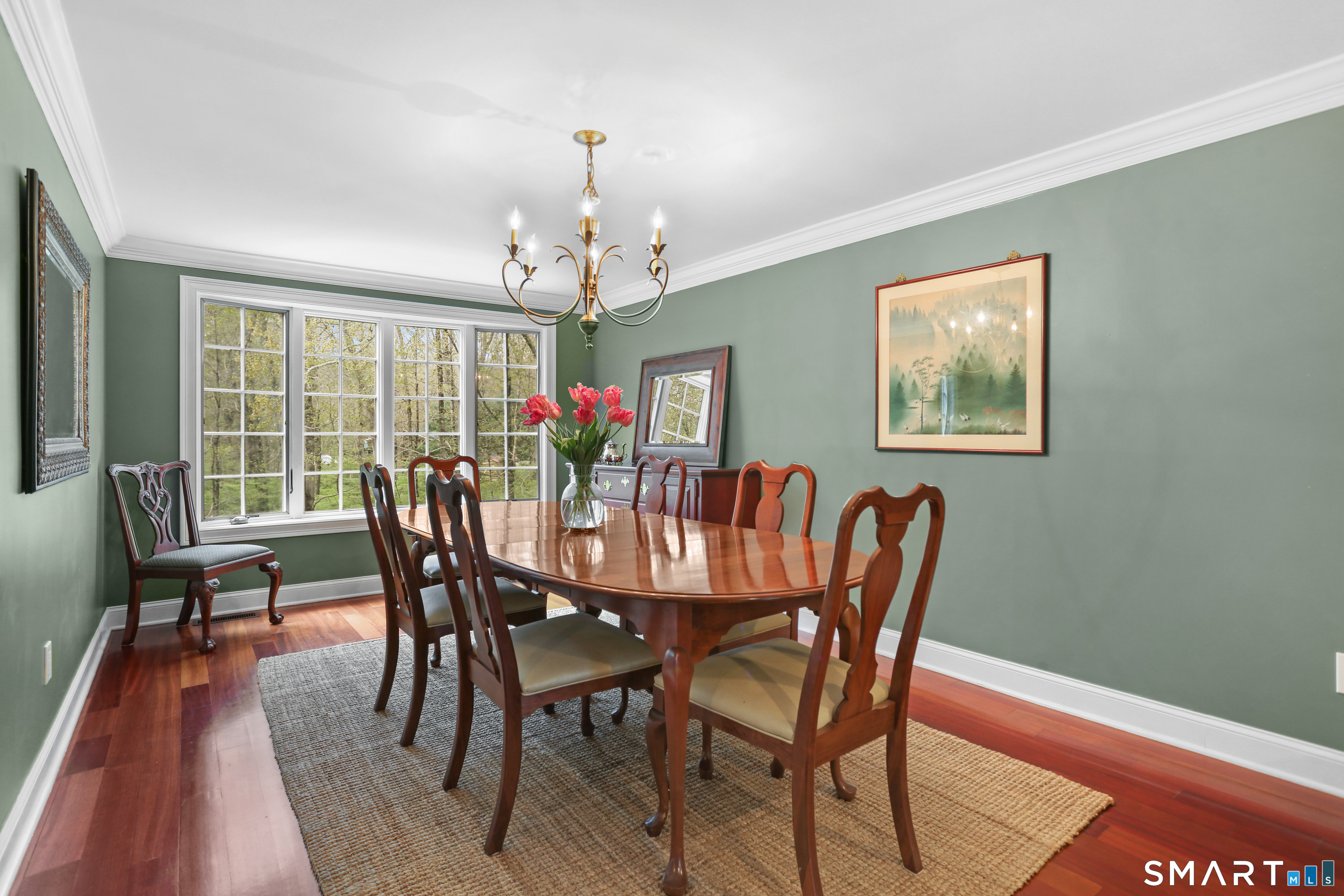 4041 Redding Road Fairfield, CT 06824 - Photo 11 of 33 a view of a dining room with furniture window and wooden floor