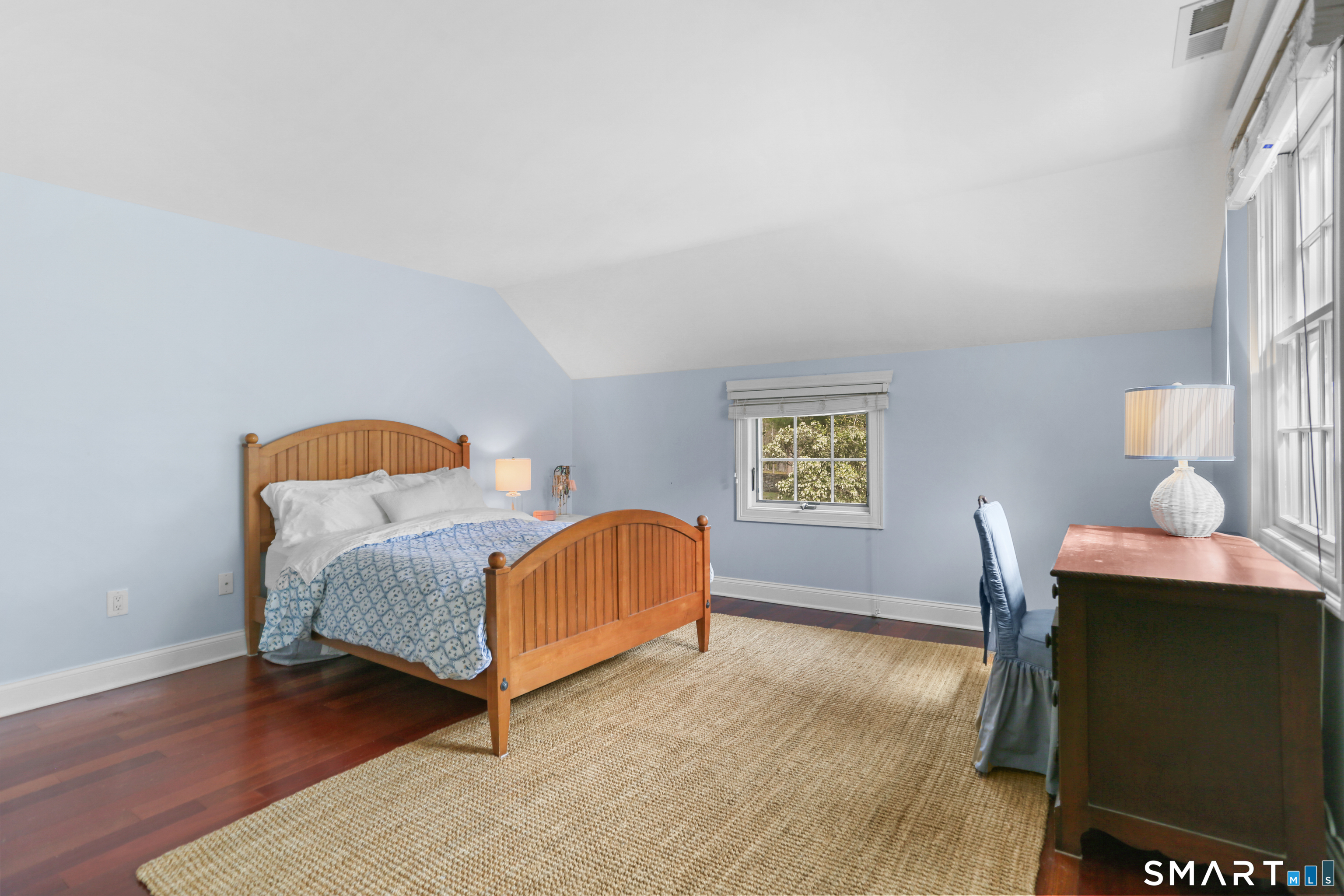 4041 Redding Road Fairfield, CT 06824 - Photo 29 of 33 a bedroom with a bed and wooden floor
