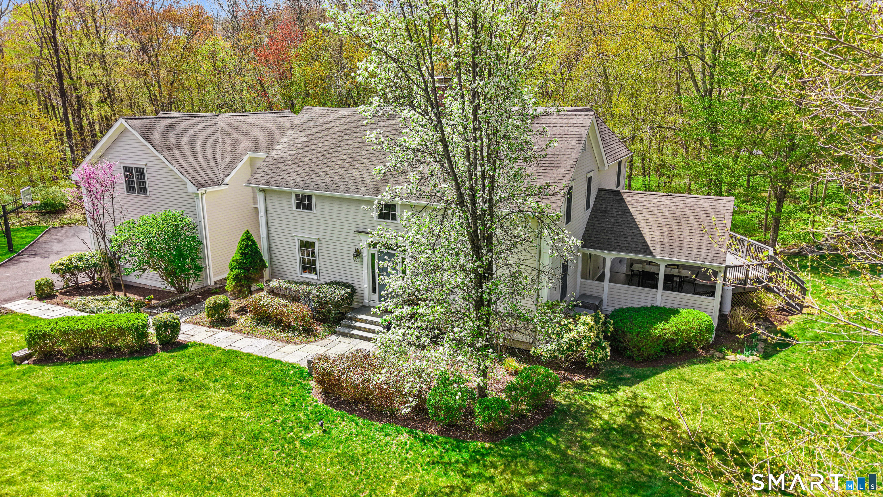 4041 Redding Road Fairfield, CT 06824 - Photo 3 of 33 an aerial view of a house with a garden and trees