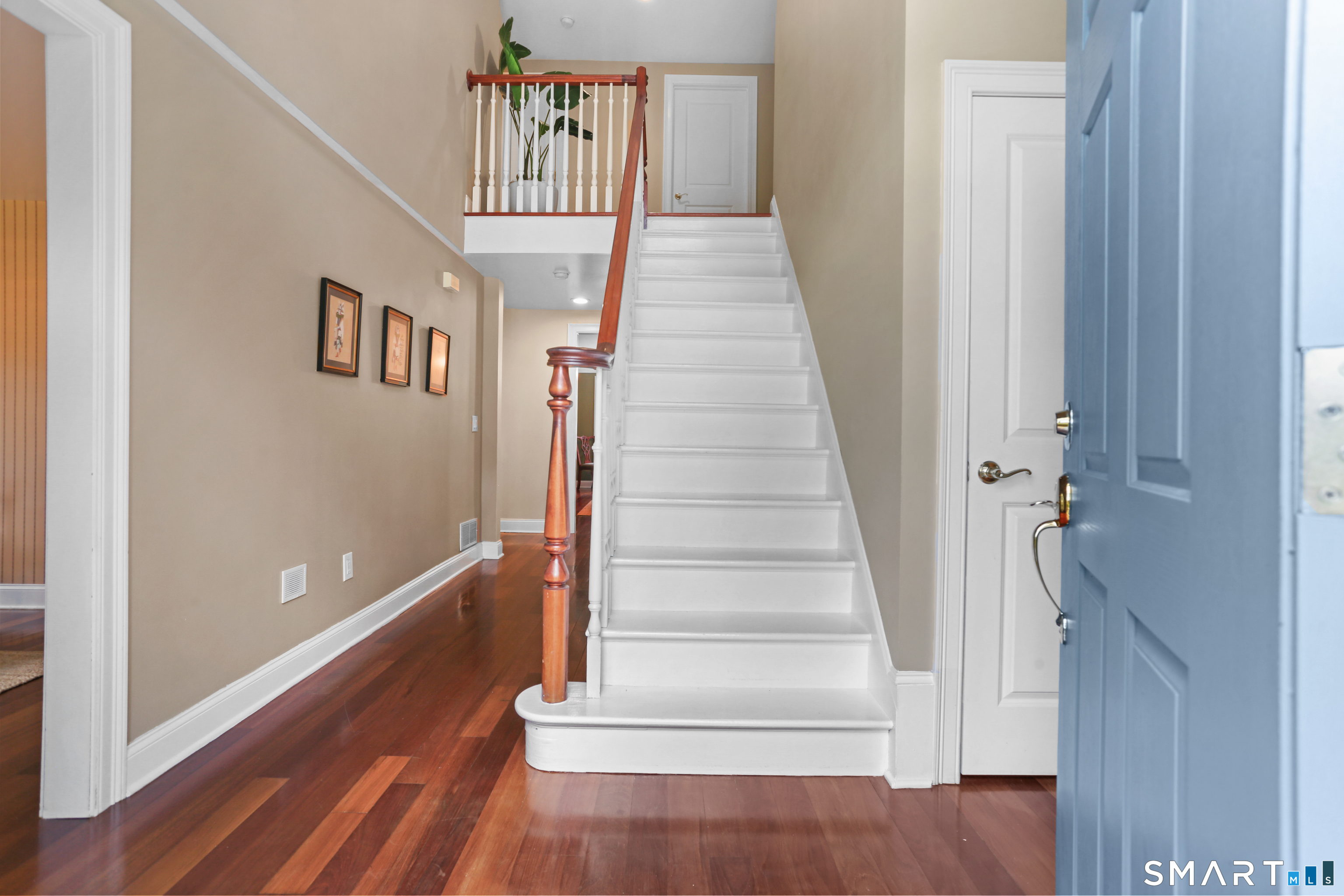 4041 Redding Road Fairfield, CT 06824 - Photo 6 of 33 a view of entryway and hall with wooden floor