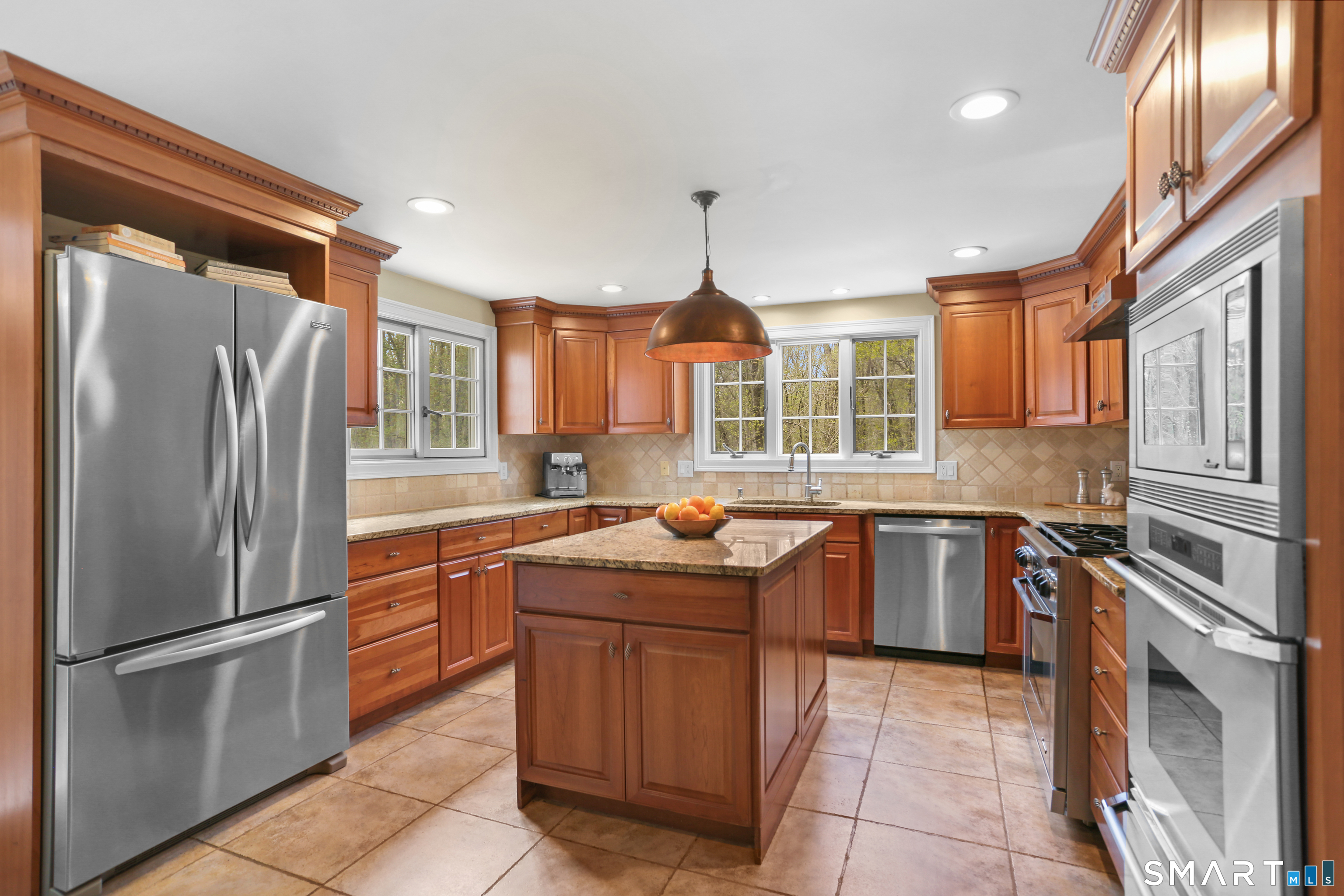 4041 Redding Road Fairfield, CT 06824 - Photo 8 of 33 a kitchen with stainless steel appliances granite countertop a refrigerator a oven a sink and a counter