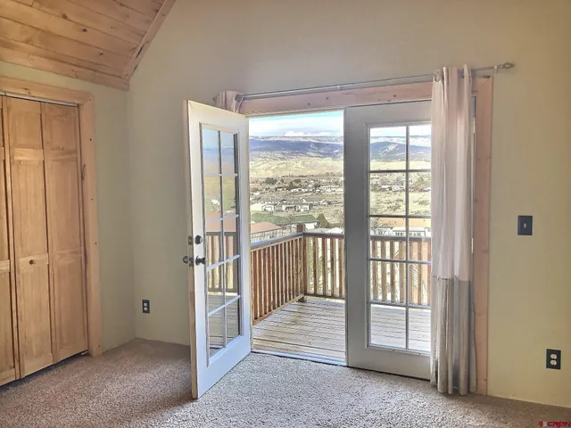 a view of a room with a large window