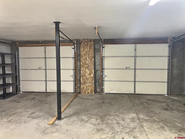 a view of roof deck with chair and wooden floor