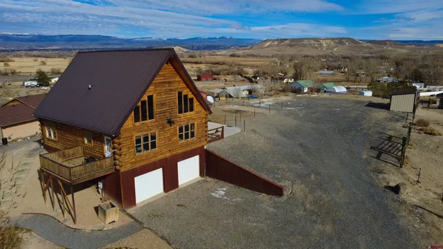 a view of a backyard with furniture