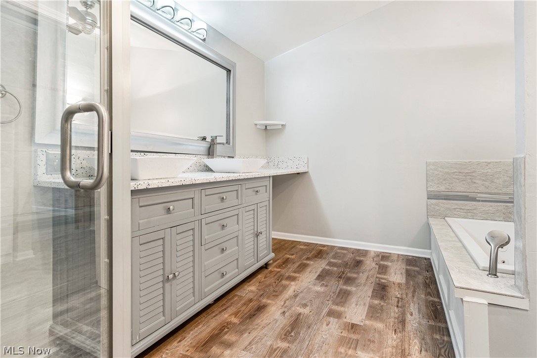 3428 South Smith Road Fairlawn, OH 44333 - Photo 13 of 30 Bathroom featuring independent shower and bath, wood-type flooring, and vanity