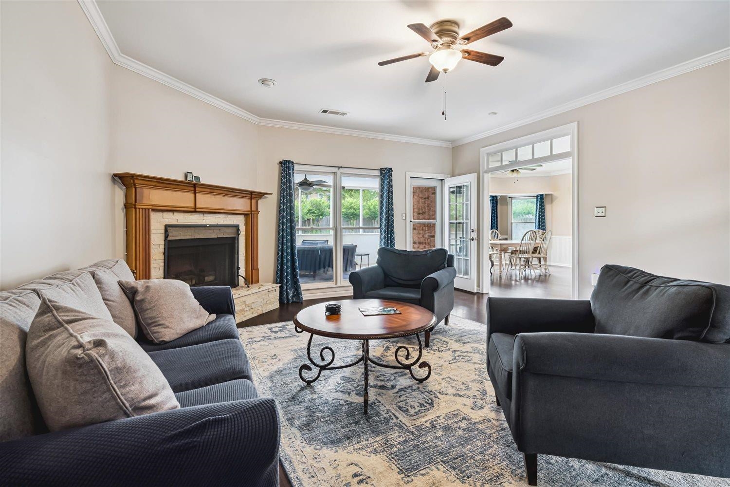1489 John Ridge Drive Collierville, TN 38017 - Photo 12 of 39 a living room with furniture and a fireplace