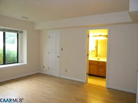 1044 Amber Ridge Road Charlottesville, VA 22901 - Photo 28 of 40 an empty room with a window