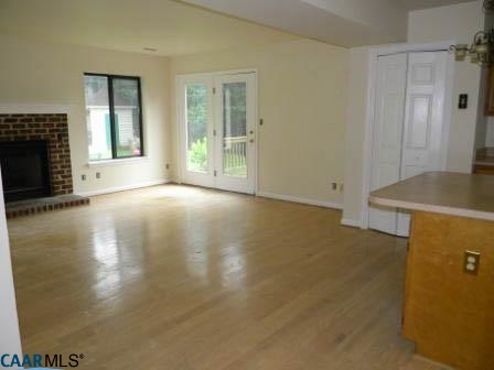 1044 Amber Ridge Road Charlottesville, VA 22901 - Photo 35 of 40 an empty room with windows and fireplace