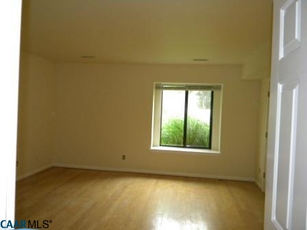 1044 Amber Ridge Road Charlottesville, VA 22901 - Photo 8 of 40 an empty room with a window