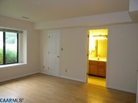 1044 Amber Ridge Road Charlottesville, VA 22901 - Photo 10 of 40 a view of an empty room and a window