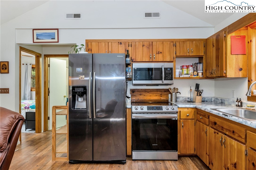 508 Curly Q Drive Crumpler, NC 28617 - Photo 20 of 39 a kitchen with a refrigerator sink and microwave