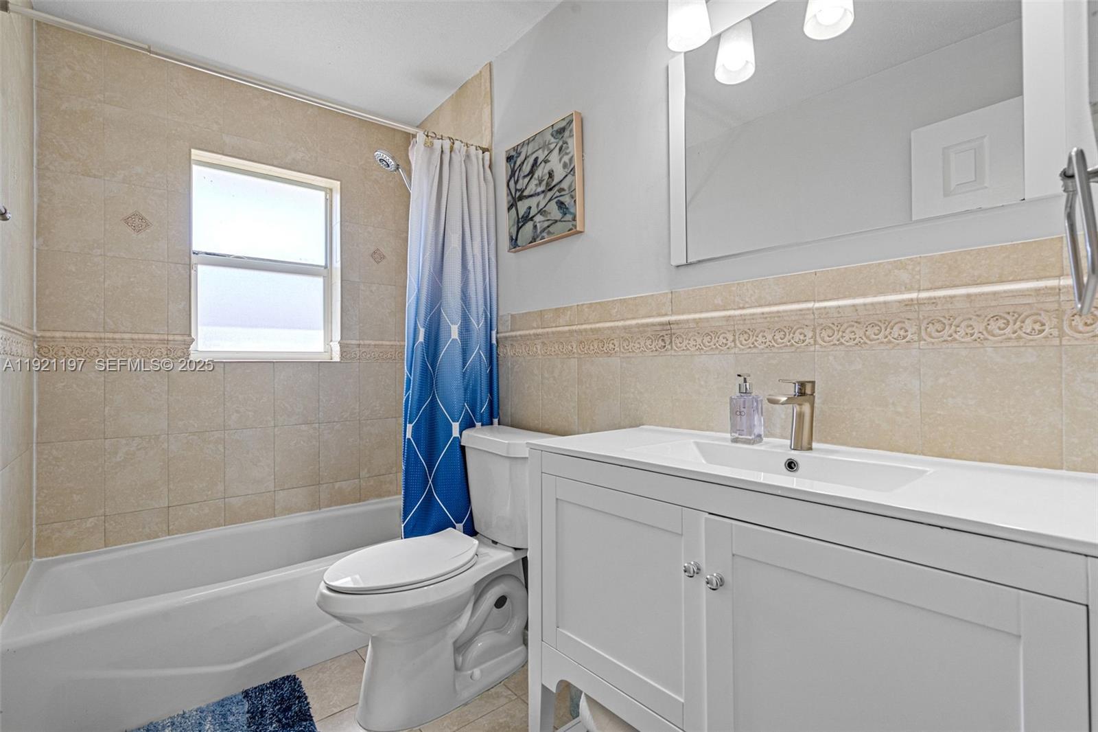 7004 Southwest 139th Place Miami, FL 33183 - Photo 34 of 54 a bathroom with a sink a toilet and shower