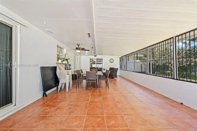 a view of a dining room with furniture window and outside view