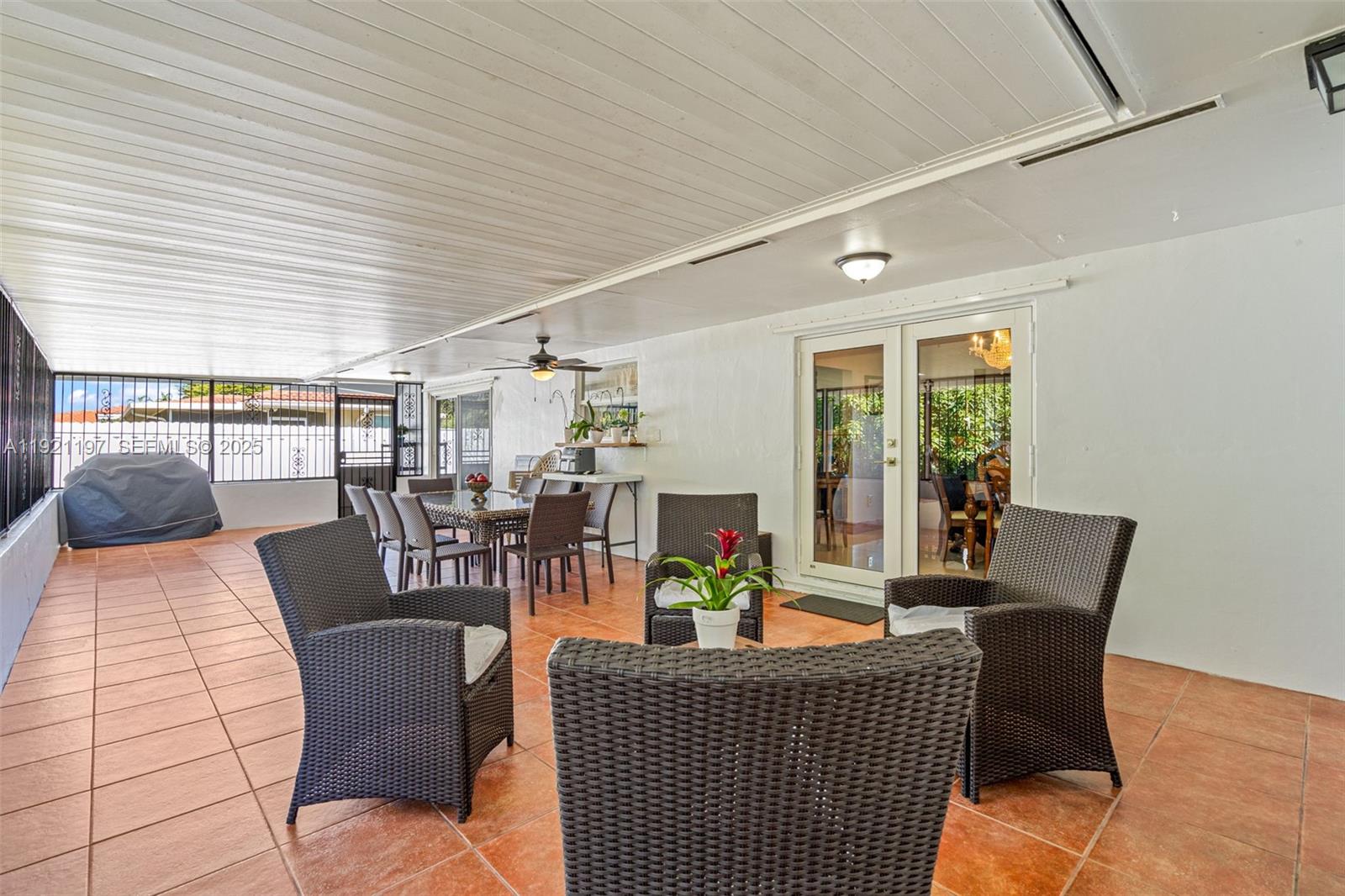 7004 Southwest 139th Place Miami, FL 33183 - Photo 39 of 54 a dining room with furniture wooden floor and a potted plant