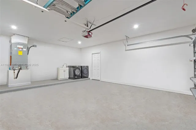 a view of a backyard with large trees and wooden fence