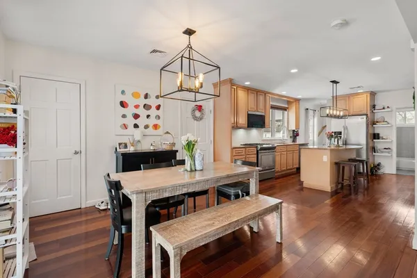 a view of a dining room with furniture and wooden floor