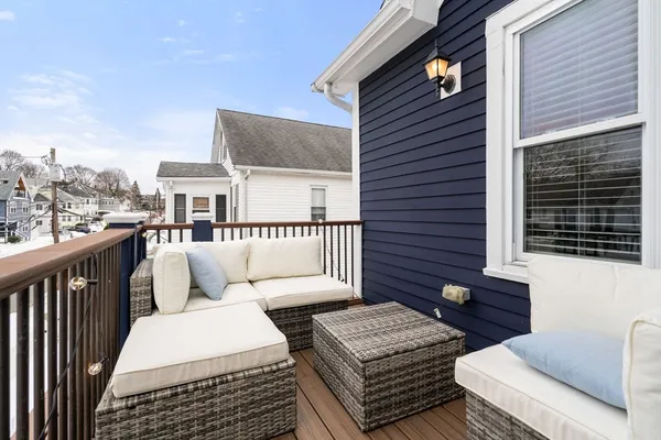 a balcony a with a table and chairs