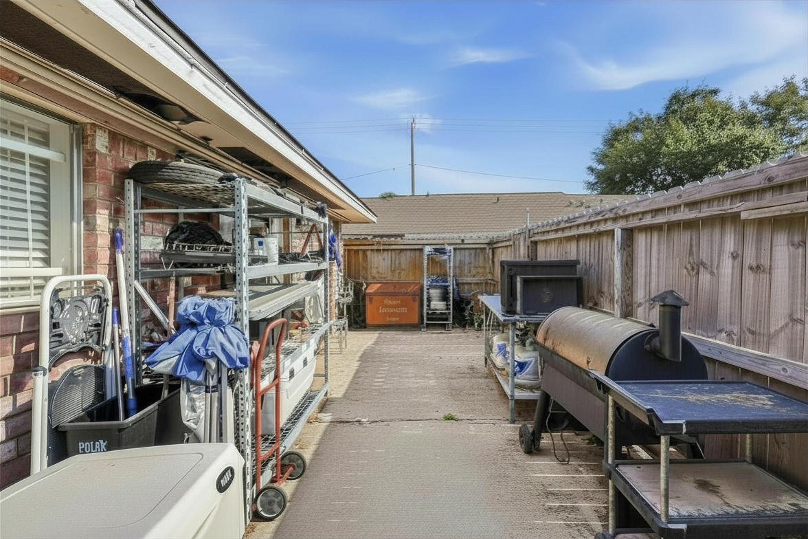 9458 Neuens Road, Unit 9458 Houston, TX 77080 - Photo 20 of 22 Back Exterior. Natural gas generator included in sale! Powers the whole house!