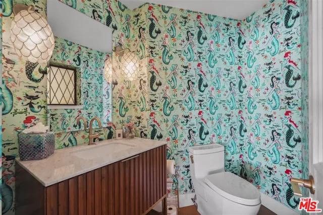 a view of staircase with white walls and railing