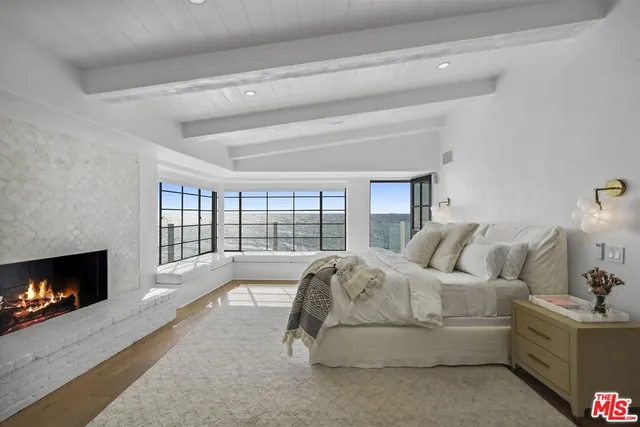 a bathroom with a granite countertop sink mirror and shower