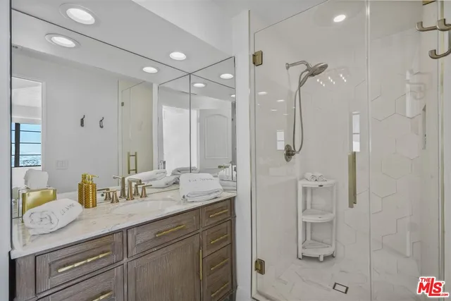 a bedroom with a large bed and a large window