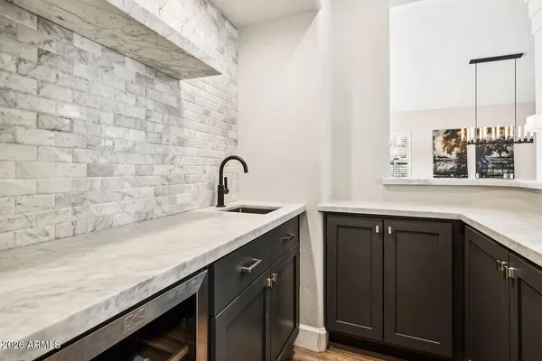 a view of kitchen island with stainless steel appliances
