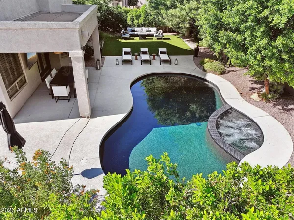 a building outdoor space with patio furniture and potted plants