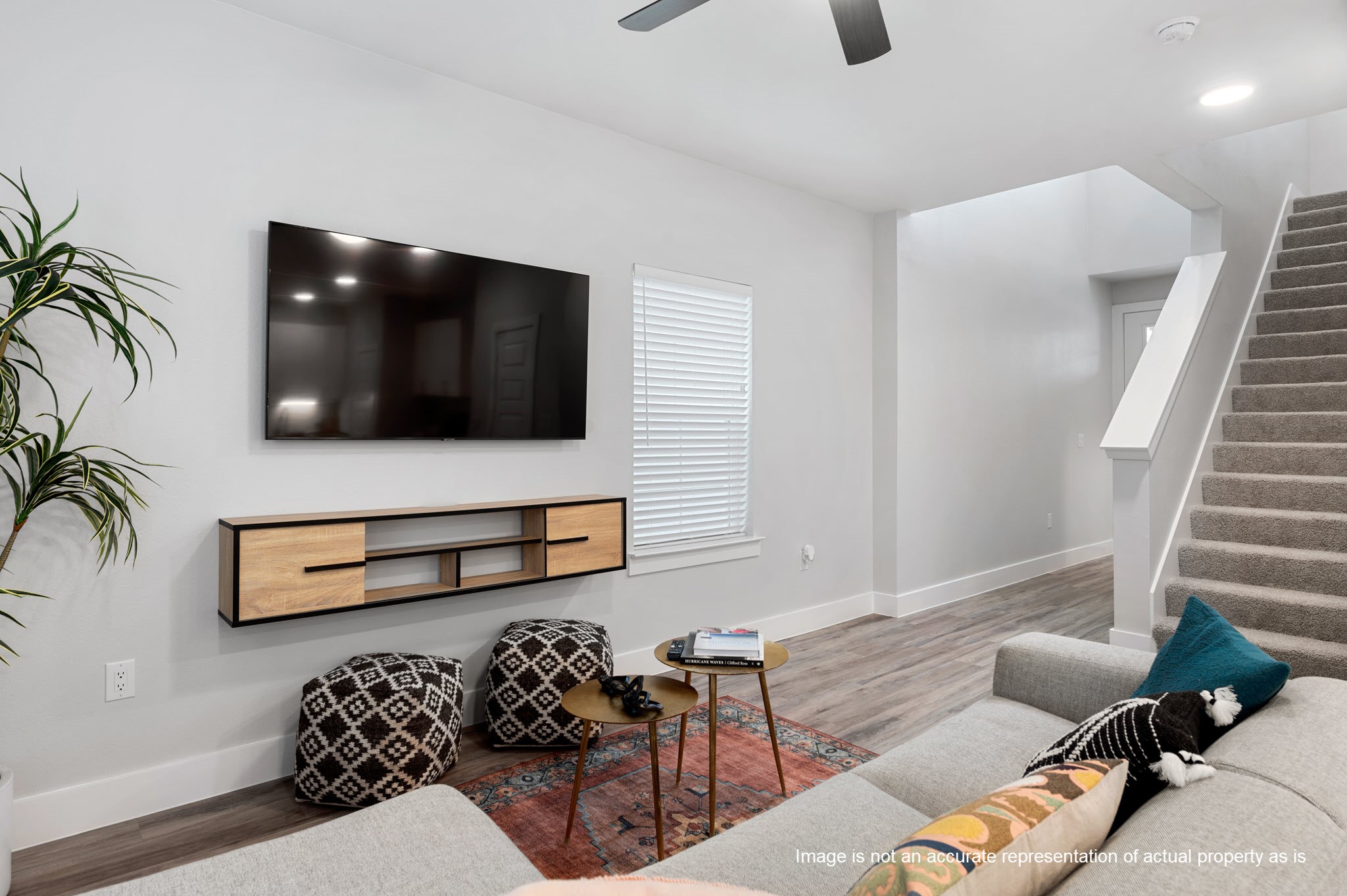 28328-425 Birnham Woods Drive Spring, TX 77386 - Photo 11 of 42 a living room with furniture and a flat screen tv