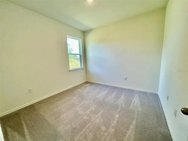 an empty room with a bench