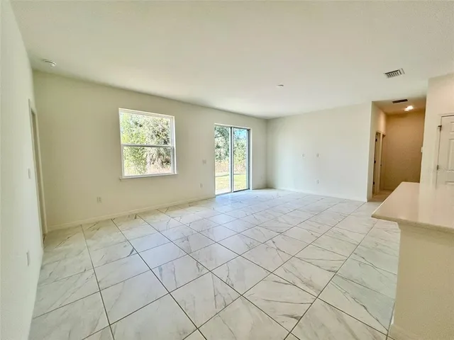 a view of a livingroom with furniture and chandelier